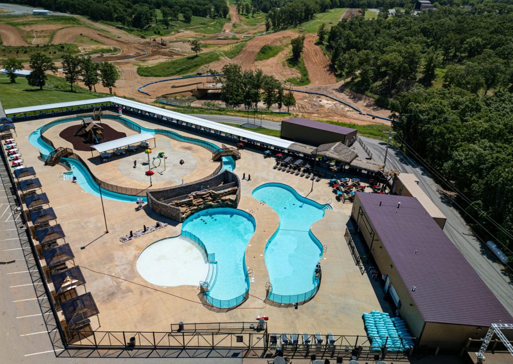 Aerial view of a water park with pools and slides.